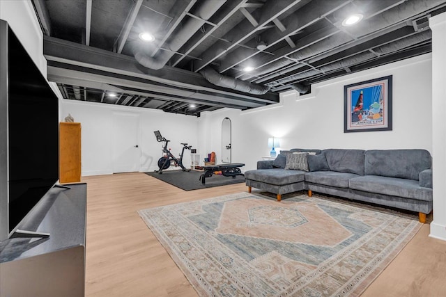 living area featuring wood finished floors and baseboards