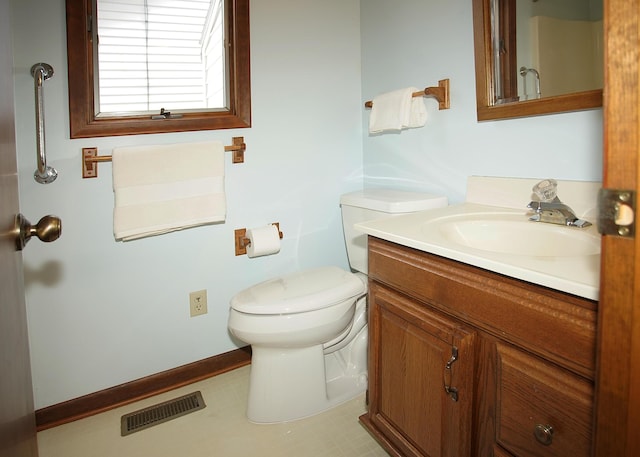 half bathroom with toilet, baseboards, visible vents, and vanity