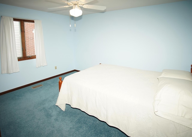 carpeted bedroom featuring visible vents, ceiling fan, and baseboards