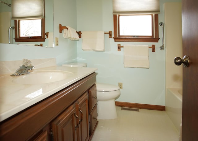 full bathroom with visible vents, plenty of natural light, vanity, and toilet