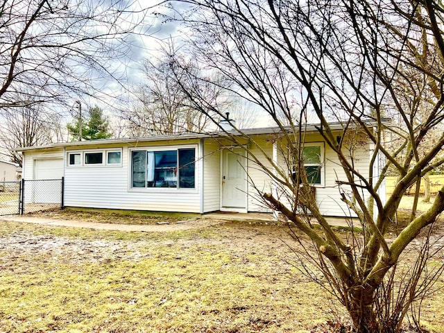 ranch-style house featuring fence and an attached garage