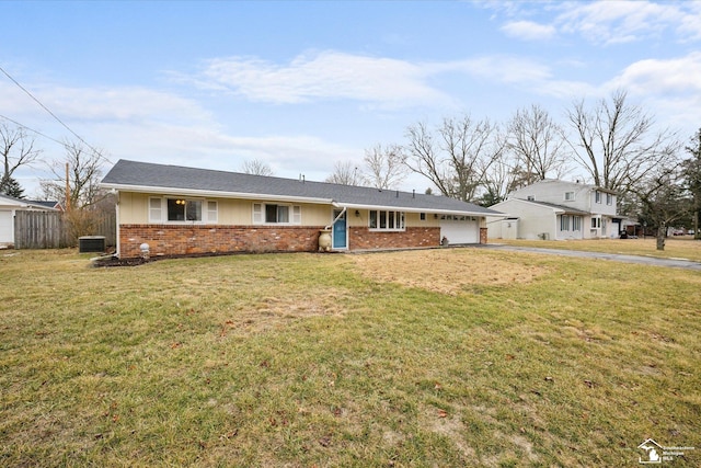 ranch-style home featuring a garage, brick siding, aphalt driveway, fence, and a front yard