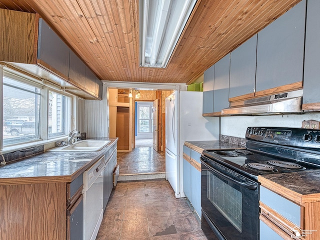 kitchen featuring black / electric stove, under cabinet range hood, a sink, dishwasher, and dark countertops