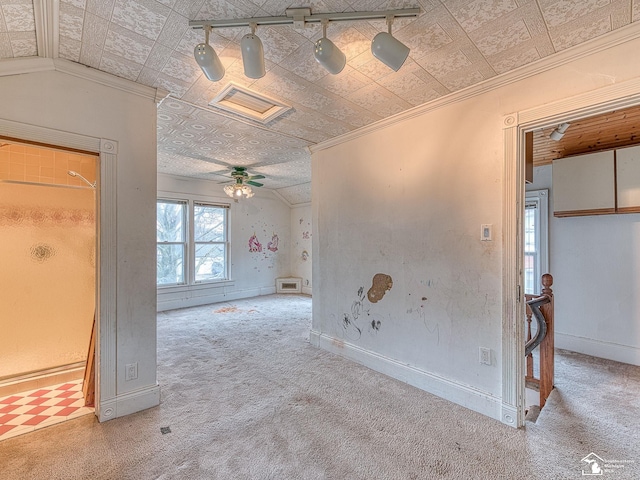 spare room featuring an ornate ceiling, carpet, and crown molding