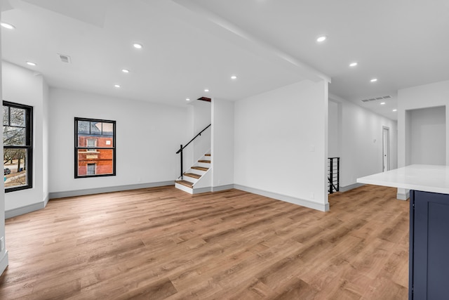 interior space featuring light wood finished floors, visible vents, and recessed lighting