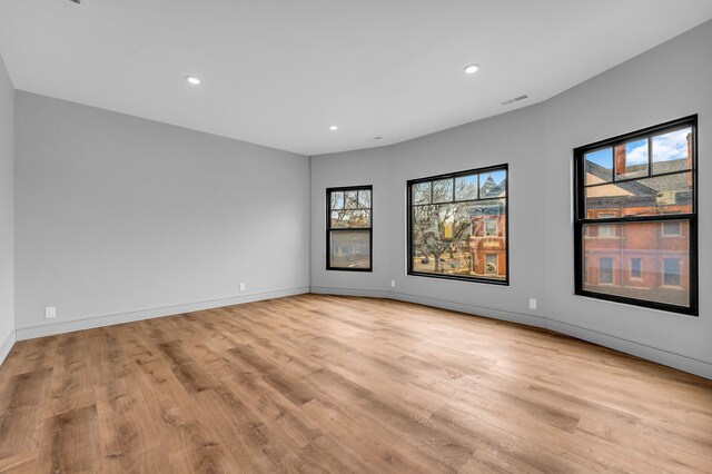 4301 Avery St, Detroit, MI 48208 - spare room featuring plenty of natural light, light wood finished floors, recessed lighting, and baseboards