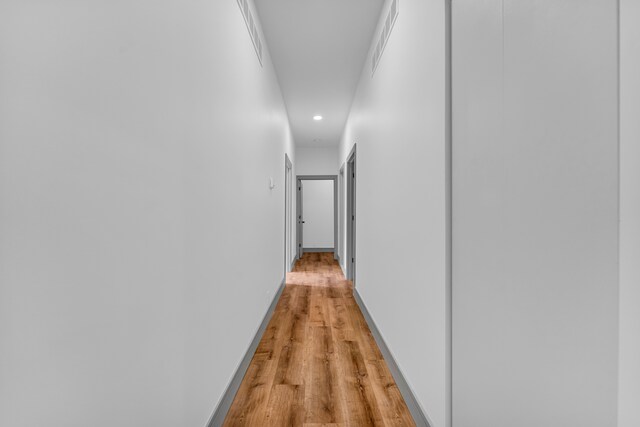 4301 Avery St, Detroit, MI 48208 - hallway featuring recessed lighting, light wood-style floors, and baseboards