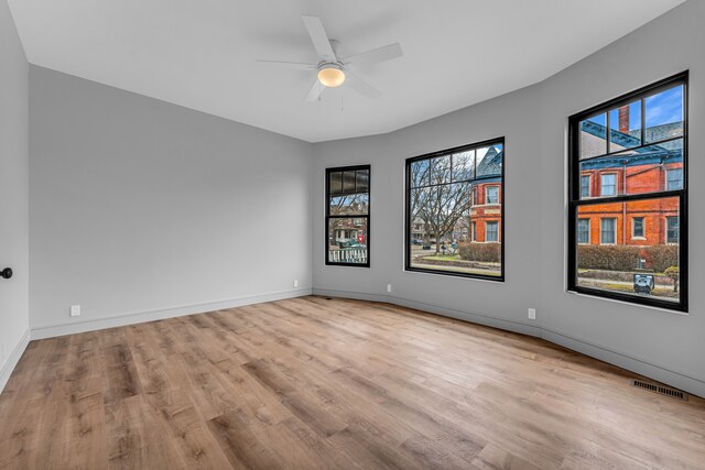 4301 Avery St, Detroit, MI 48208 - unfurnished room featuring wood finished floors, healthy amount of natural light, baseboards, and ceiling fan