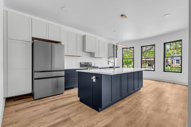 4301 Avery St, Detroit, MI 48208 - kitchen featuring stainless steel appliances, light countertops, a sink, light wood-type flooring, and recessed lighting
