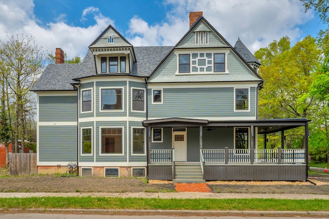 4301 Avery St, Detroit, MI 48208 - victorian-style house featuring a chimney, covered porch, and roof with shingles