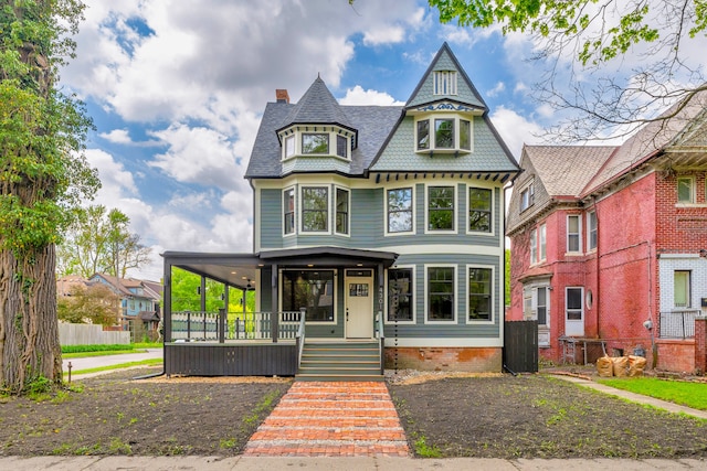 4301 Avery St, Detroit, MI 48208 - victorian house with a porch, a chimney, and a shingled roof
