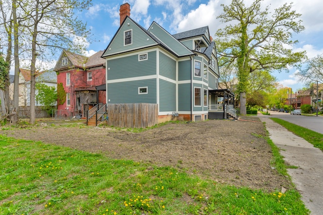 4301 Avery St, Detroit, MI 48208 - view of side of property featuring a chimney and fence