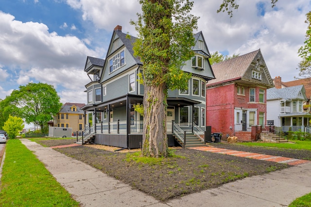 4301 Avery St, Detroit, MI 48208 - victorian house with a porch, a chimney, and a residential view