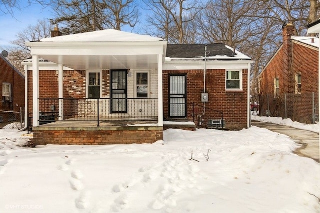 view of front of property with a porch and brick siding