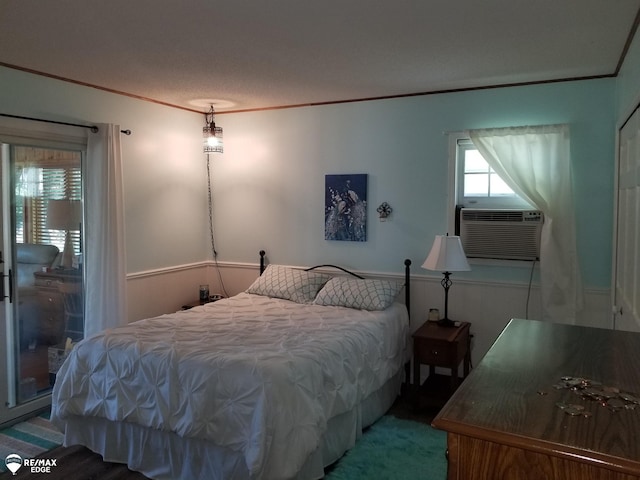 bedroom featuring cooling unit and crown molding