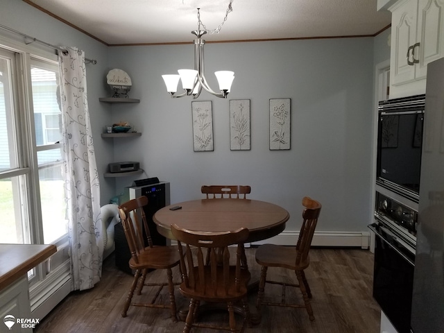 dining area with a baseboard heating unit, a notable chandelier, ornamental molding, and dark wood-style flooring