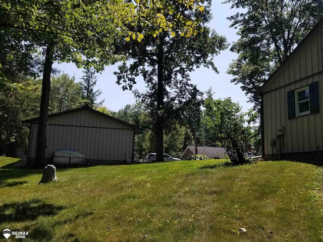 view of yard with an outbuilding and a pole building