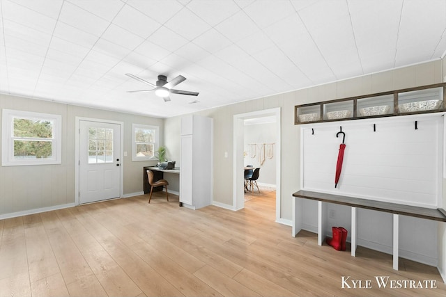 mudroom featuring a healthy amount of sunlight, light wood-style floors, ceiling fan, and baseboards