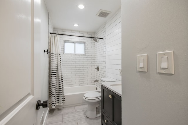 bathroom with visible vents, toilet, shower / bath combo with shower curtain, vanity, and recessed lighting