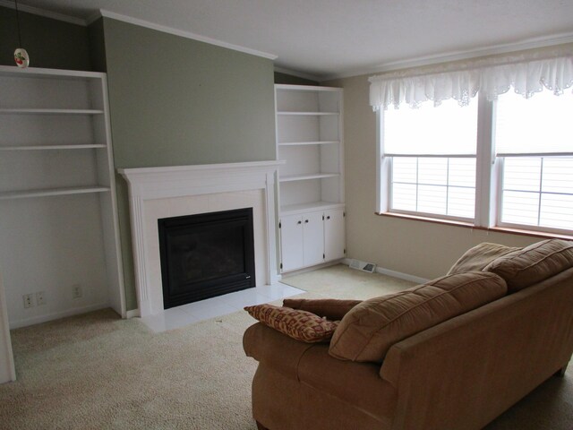 living room with baseboards, visible vents, light colored carpet, a tile fireplace, and crown molding