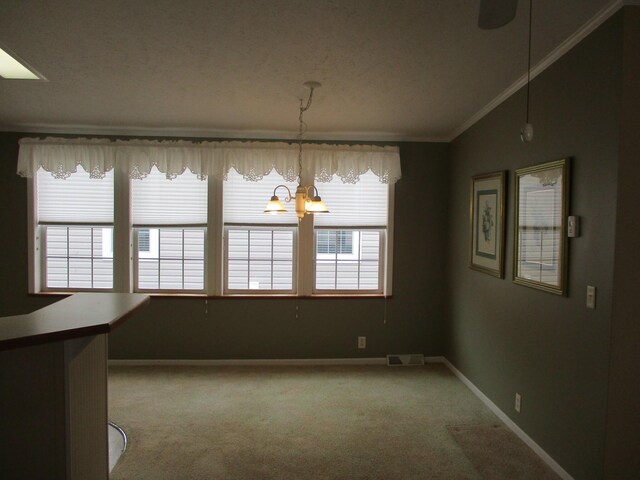 unfurnished dining area featuring visible vents, baseboards, light colored carpet, ornamental molding, and vaulted ceiling