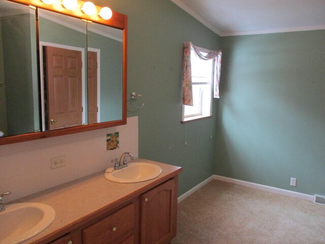 full bathroom with double vanity, decorative backsplash, a sink, and crown molding