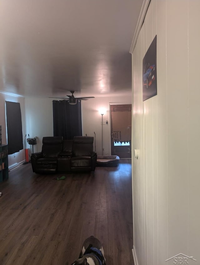 interior space with dark wood-style flooring and a ceiling fan