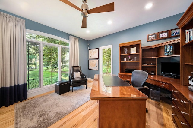 office with light wood-style floors, recessed lighting, baseboards, and a ceiling fan