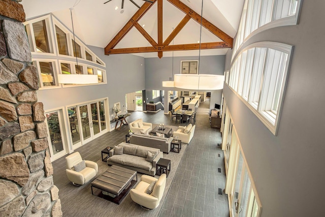 living room featuring high vaulted ceiling