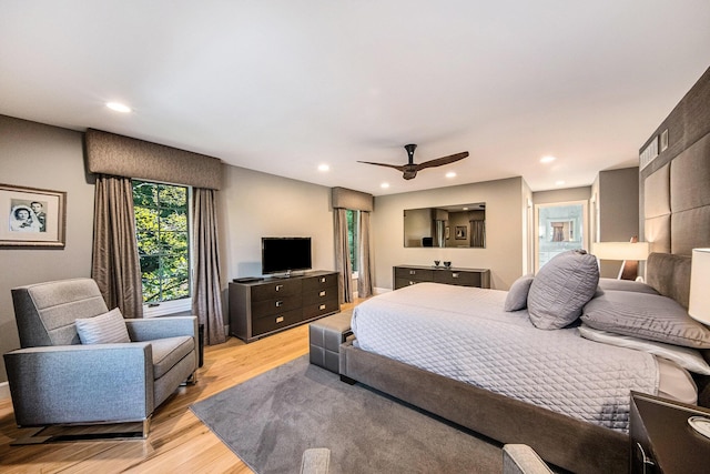 bedroom with light wood finished floors, a ceiling fan, and recessed lighting