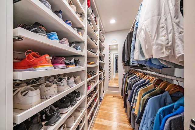 walk in closet featuring light wood-style floors