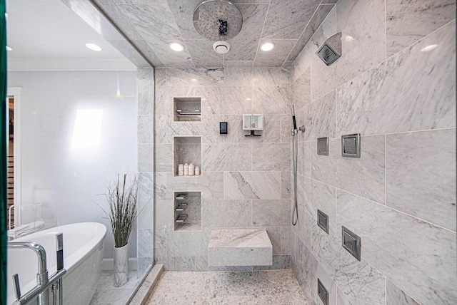 bathroom with a soaking tub, tiled shower, and recessed lighting