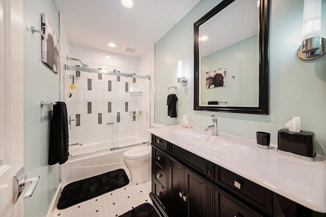 full bath with visible vents, toilet, shower / bath combination with glass door, vanity, and recessed lighting