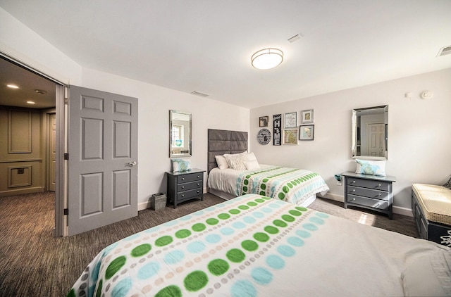 bedroom with visible vents and baseboards