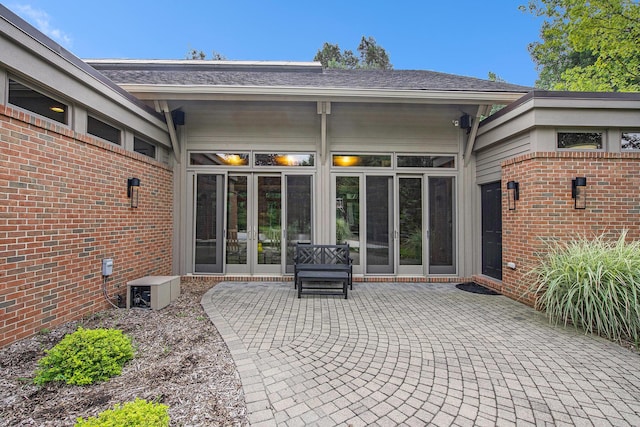 view of patio / terrace with ac unit and french doors