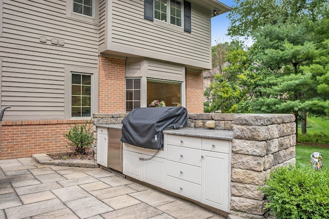 view of patio / terrace featuring a grill and area for grilling