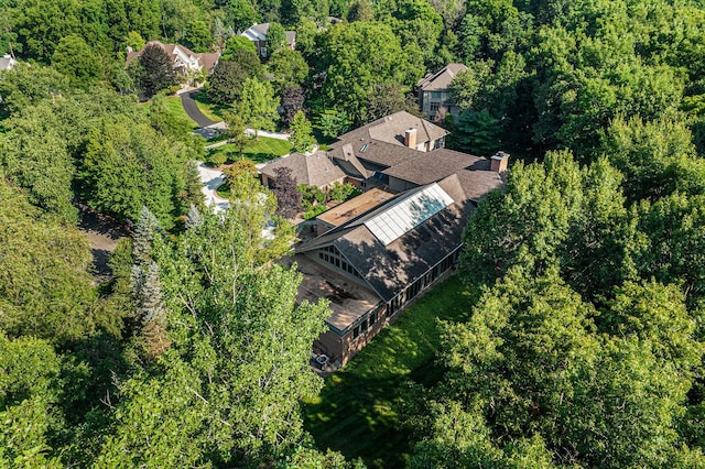 drone / aerial view featuring a view of trees