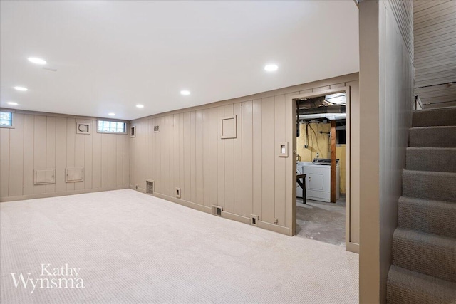 basement with carpet floors, visible vents, stairs, and washer / clothes dryer