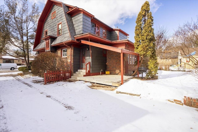 view of front of property featuring brick siding