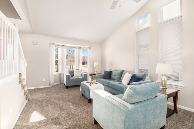 carpeted living room featuring lofted ceiling, ceiling fan, and baseboards