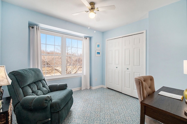 office featuring tile patterned floors, a ceiling fan, and baseboards