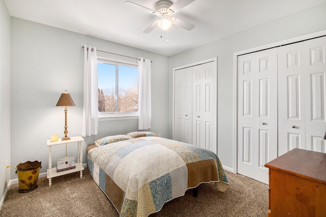 carpeted bedroom with multiple closets, ceiling fan, and baseboards