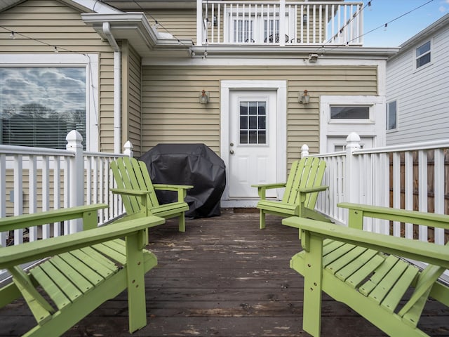 wooden terrace featuring grilling area