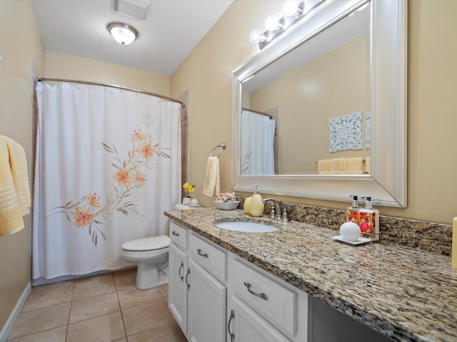 full bathroom featuring toilet, visible vents, baseboards, vanity, and tile patterned floors