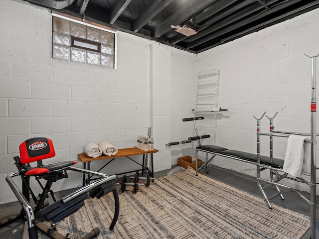 workout room with concrete block wall