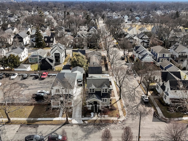 birds eye view of property with a residential view