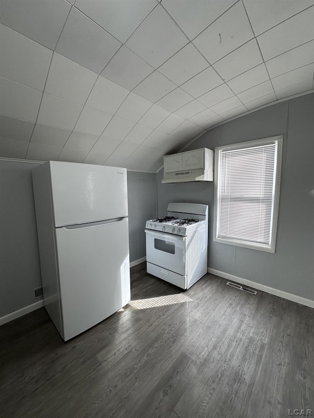 kitchen with white appliances, visible vents, dark wood-style flooring, vaulted ceiling, and white cabinetry