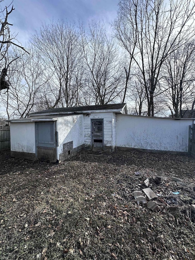 view of outdoor structure featuring fence