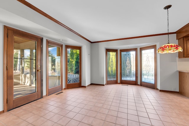 doorway featuring light tile patterned floors, visible vents, baseboards, and crown molding