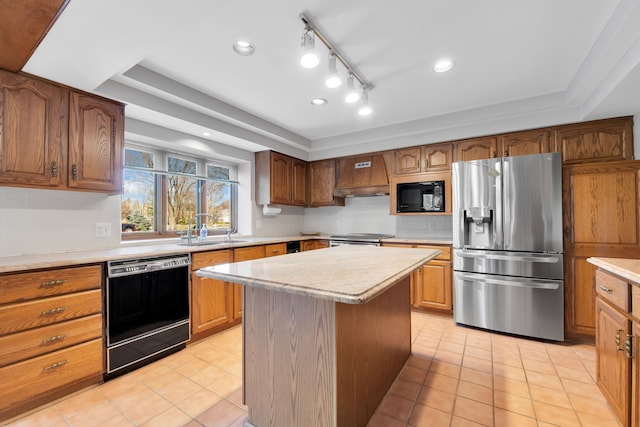 kitchen with light tile patterned floors, a kitchen island, a sink, light countertops, and black appliances